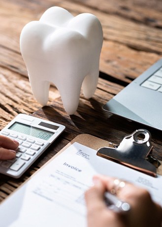 a patient filling out a dental insurance form