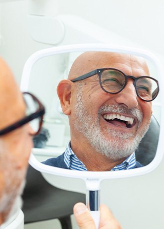 a dental implant patient smiling