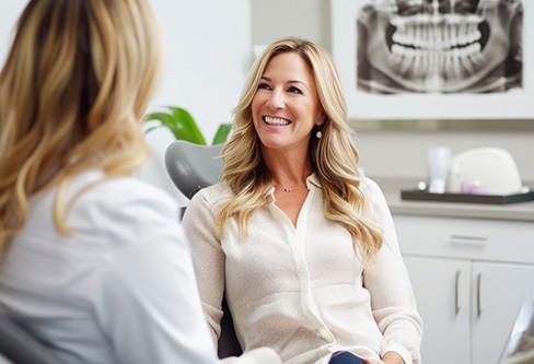 Female patient talking to her dentist