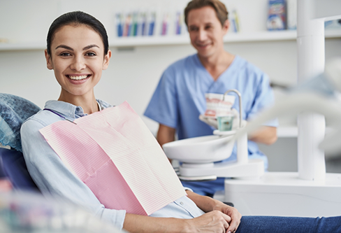 Smiling woman sitting in the dental chair
