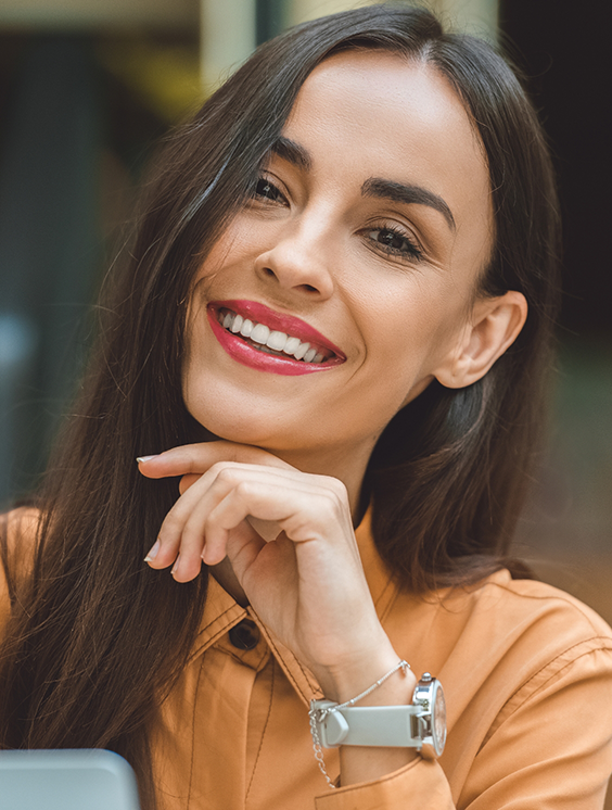 Brunette woman smiling with flawless teeth
